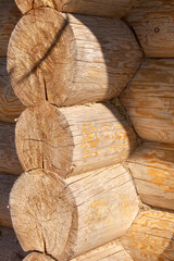 construction material round logs for the construction of wooden houses