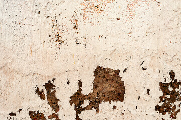 Texture of a concrete wall with cracks and scratches which can be used as a background