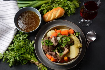 Pot-au-feu, traditional french stew. Stewed beef and potatoes. In France considered a national dish. - obrazy, fototapety, plakaty