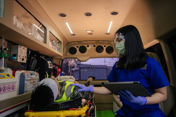 In epidemic crisis coronavirus (COVID-19), Asian female paramedic provide medical help to injured...