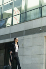 Businesswoman is walking towards the company
