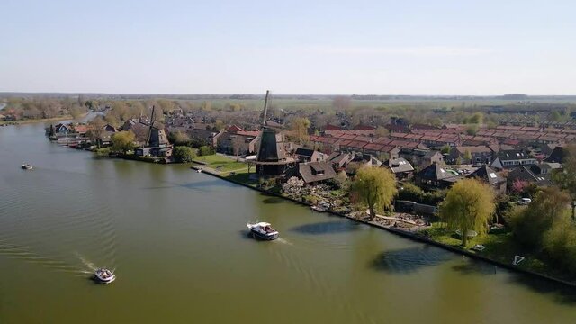 Weesp small city in North holland, The Netherlands, city view along the water aerial drone footage.
