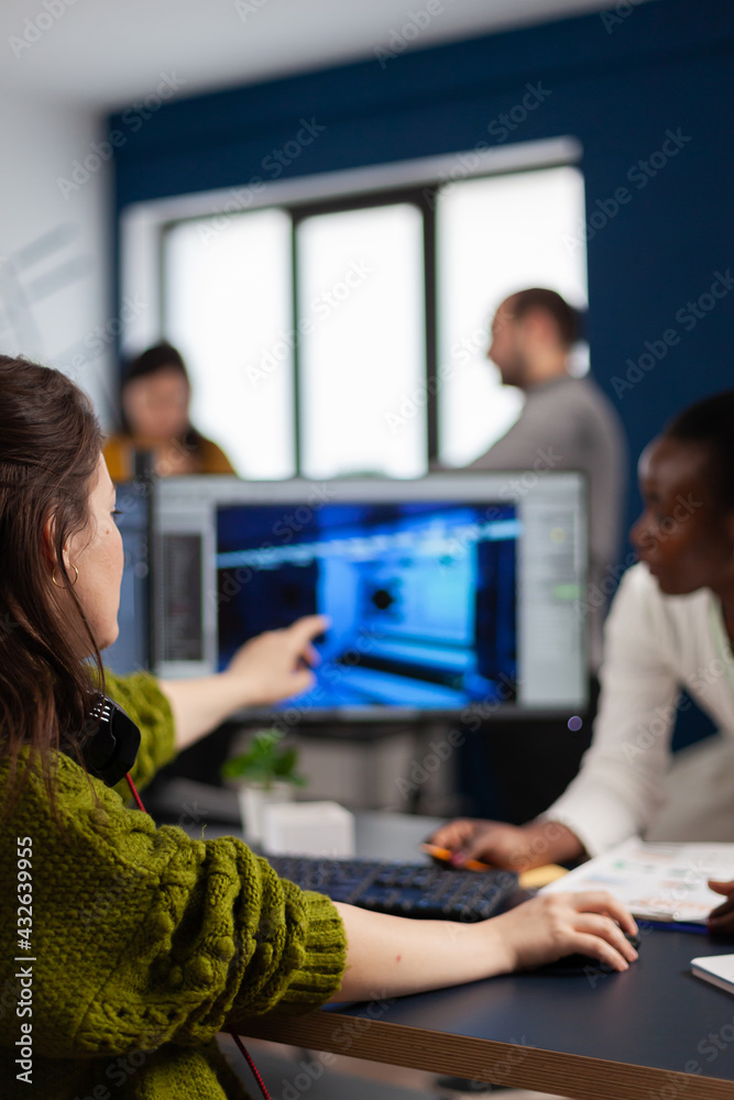 Poster gamer creator explaning to african worker how testing game level interface, developing new design in