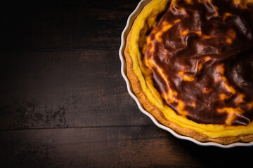 Parisian Flan, cutted classic tart served on a plate copy space. High quality photo