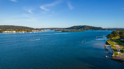 Afternoon aerial waterscape over the bay with high clouds