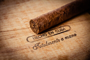 Cuban cigar on vintage wooden box
