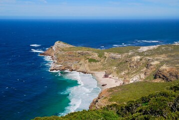 Fototapeta premium Coastline at Cape Point in South Africa, near Cape of Good Hope and Cape Town, on a sunny day, blue sky, nice clouds