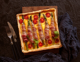 Vegetable painting focaccia, garden cake art, food trend. Italian focaccia with bacon and asparagus. Top view - 432643942