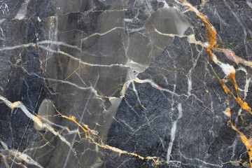 Patterned natural of dark gray marble pattern (Russia Gold) texture for design.