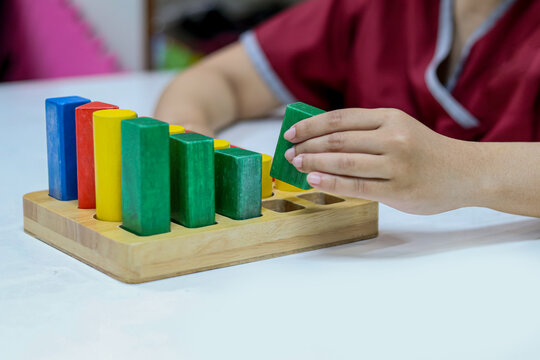 Occupational therapy: hand function training, Hand rehabilitation in stroke patient by using colorful blocks or cubes at a therapy room in the hospital.