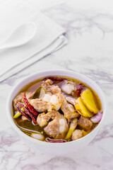 Spicy pork spare rib soup with herbs