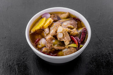 Spicy pork spare rib soup with herbs