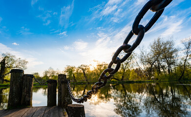Naklejka premium old wooden pier with chain
