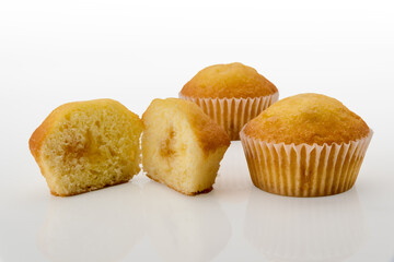 muffin cut with whole muffins isolated on white background