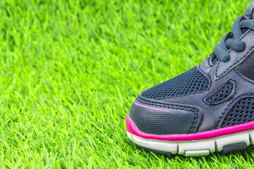 sports shoes on green grass
