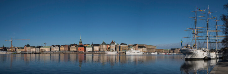 Fototapeta na wymiar Morning spring view in the Stockholm harbor with boats and the old town Gamla Stan