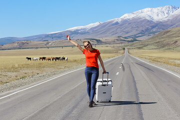 sexy girl in dress with suitcase on the highway, summer travel freedom, woman tourist