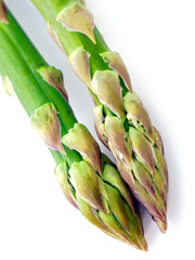 Fresh green asparagus. Vegetarian delicacy in spring. Close-up on a detail. 