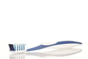 One toothbrush, close-up, isolated on white.