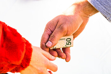 Hand giving money like bribe or tips isolated, hard worked hand taking dollars money. Currency...