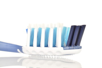 One toothbrush, close-up, isolated on white.
