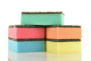 Several colored foam sponges, close-up, isolated on white.