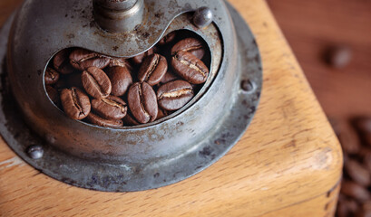 Vintage classic antique italy german hand manual ground coffee grinder powder of organic roasted espresso bean cinnamon star anise aroma in retro old wooden rustic homemade cafe shop barista style