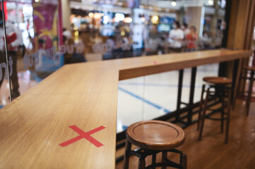 Social distancing rules one table per person in practice at cofee cafe  to reduce risk of coronavirus COVID-19 Spread