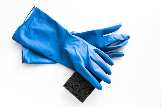 blue rubber gloves for cleaning with a washcloth on a white background. mockup cleaning