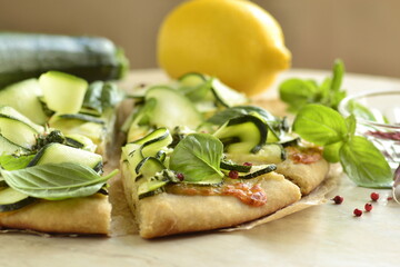 Vegetarian pizza with zucchini, mozzarella and basil