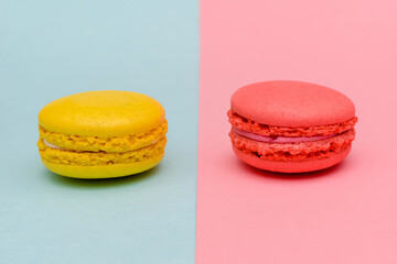 two color macaron cakes on a two paper color background