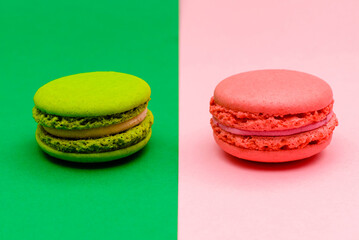 two color macaron cakes on a two paper color background