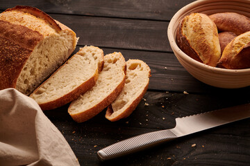 Homemade tartine bread on dark wooden table