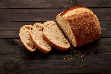 Homemade tartine bread on dark wooden table
