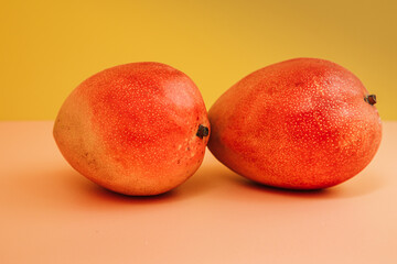ripe mango on a colored background. Suitable for advertising fruit in the store 