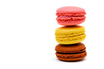 three color macaron cakes on a white background