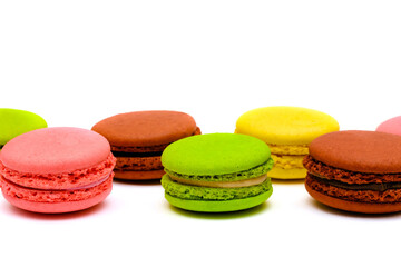 Fototapeta na wymiar different multicolored macaron cakes on a white background