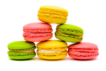 pyramid of different multicolored macaron cakes on a white background