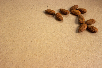 Fototapeta na wymiar The almonds are in a white bowl.Almond concept with copyspace.