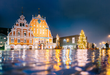 Riga, Latvia. Town Hall Square, Popular Place With Famous Landmarks On It In Night Illumination In...
