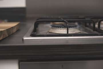 Gas cooker in modern kitchen - cleaning home appliances