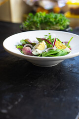 egg vegetables salad green leaves mix spinach, arugula, lettuce on the table wholesome food healthy meal snack copy space food background rustic. top view keto or paleo diet veggie or vegetarian