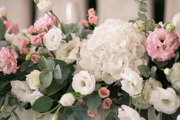 Close up of flower arrangement for wedding main table at a wedding reception.