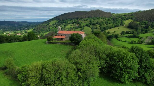 Aerial view from a drone of the hermitage of San Vicente, between Esles and Lloreda in the municipality of Santa Mar&iacute;a de Cayon in the Valles Pasiegos. Cantabria, Spain, Europe