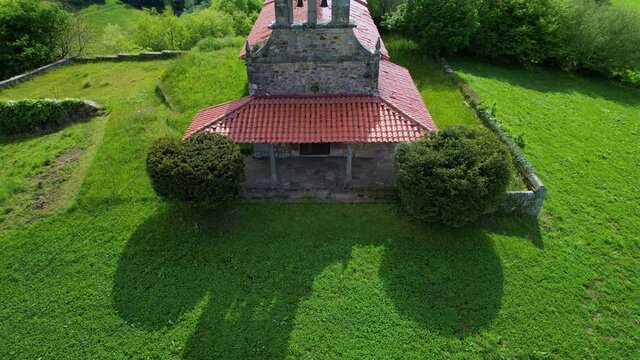 Aerial view from a drone of the hermitage of San Vicente, between Esles and Lloreda in the municipality of Santa Mar&iacute;a de Cayon in the Valles Pasiegos. Cantabria, Spain, Europe