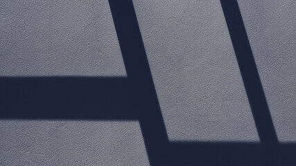 Geometric pattern on the wall formed by light and shadow