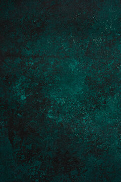 Vertical closeup shot of a dark green background for wallpapers