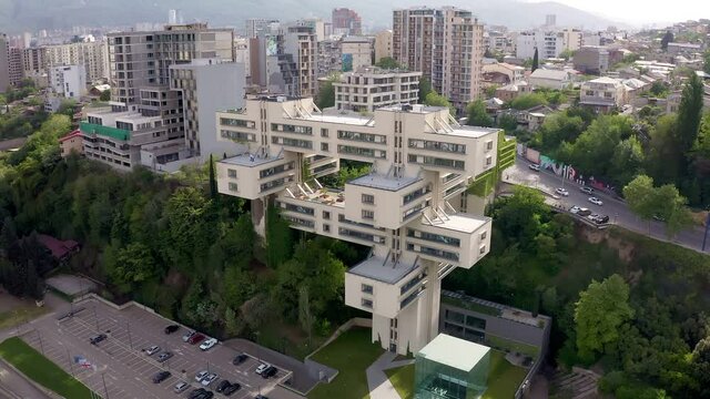 Tbilisi, Georgia. Building of Bank of Georgia headquarters ex for the Ministry of Highway. Beautiful Soviet constructivists, Brutalist and Structuralism. Aerial drone photo from above