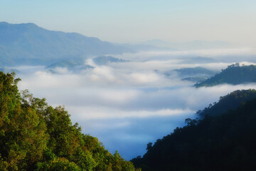 A beautiful sea of mist looking between the gorges in the morning, taken from the top of the mountain in the south of Betong District, Yala Province.