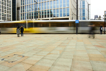 Long exposure tram in daylight Manchester St Peters Square - obrazy, fototapety, plakaty